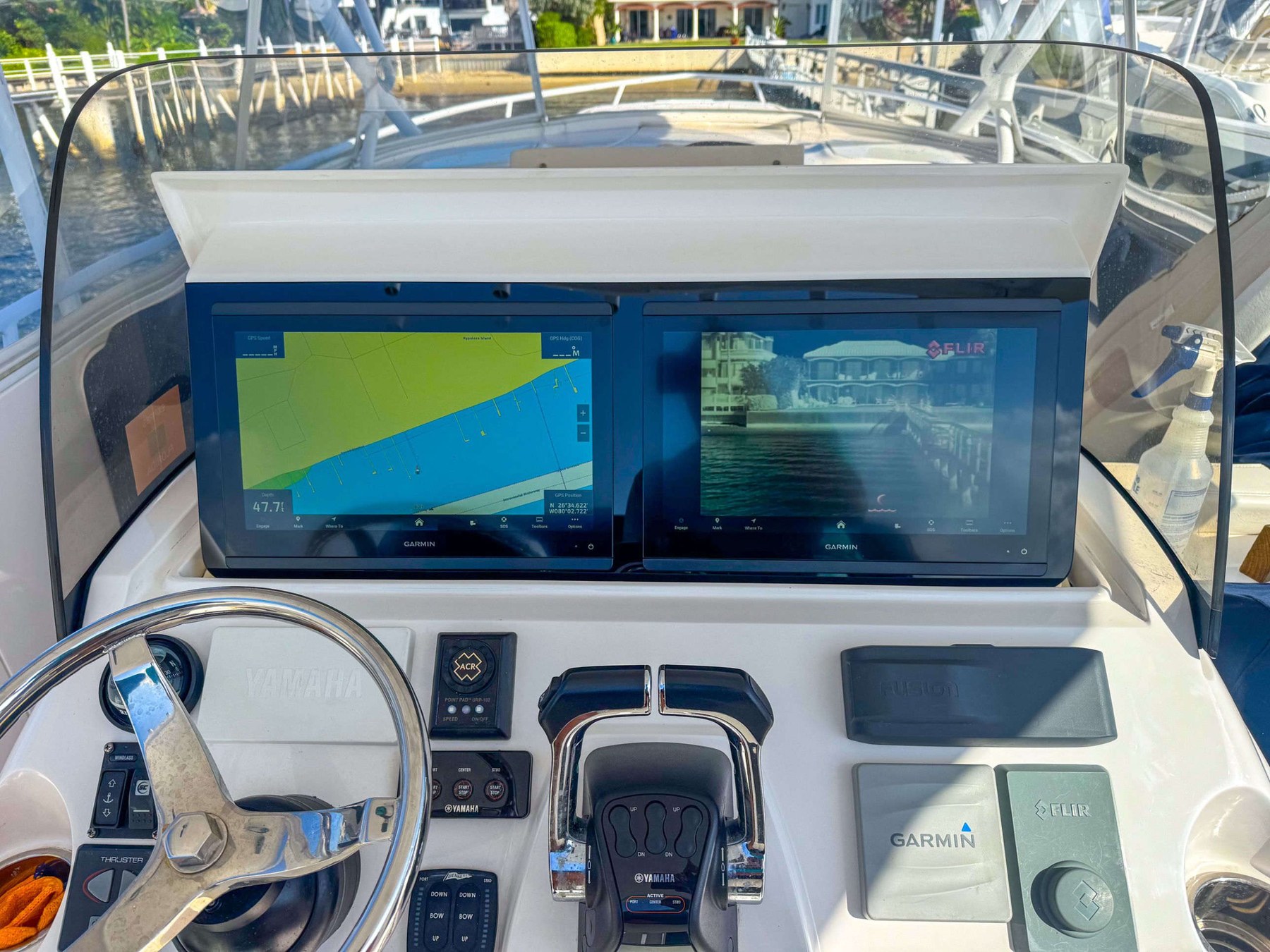 Dual Garmin helm with FLIR camera and Yamaha controls — full blacked-out build